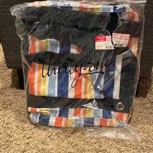 Brand new (plastic bag it comes in has a rip) small utility tote in stripe print